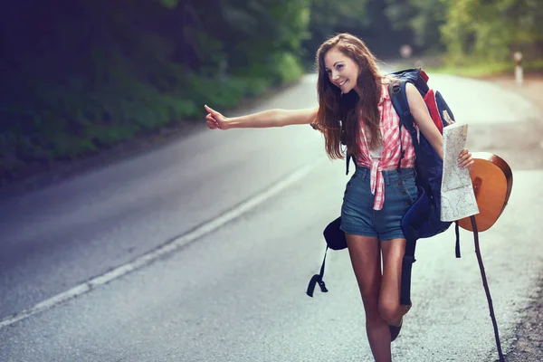 Stock image young woman traveler with backpack