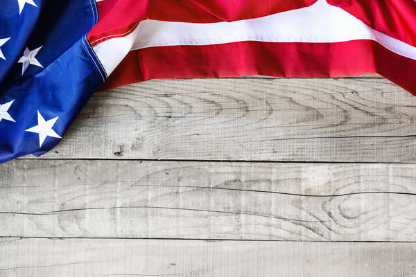 American flag over wooden background