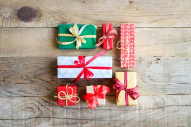 christmas gift boxes with gifts on wooden background