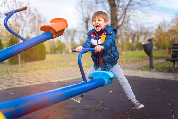 stock image happy boy playing at playground in park