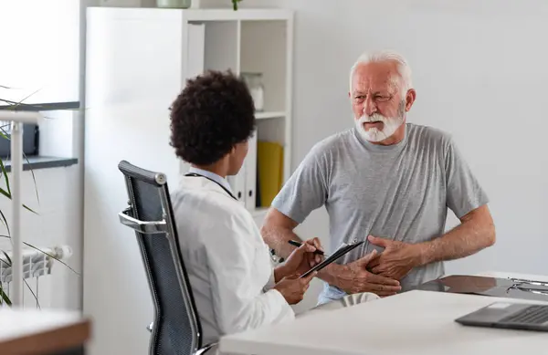 Senior Man Visiting Doctor Stock Picture