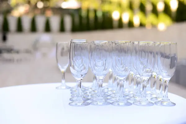 Wedding welcome drink table with glasses. Welcome Compliment for Guests. Selective focus.