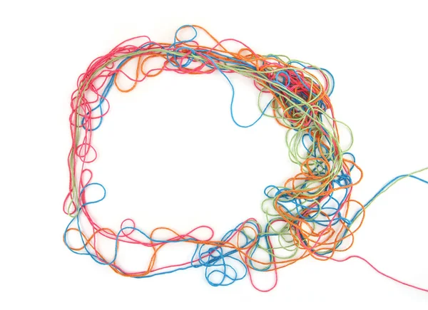 Circle of tangled colorful cotton threads isolated on white background. Abstract thread lines chaos pattern.