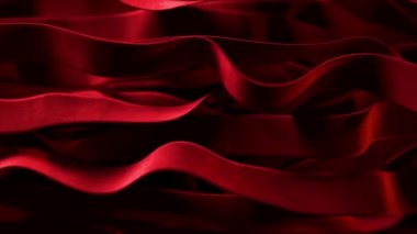 Vibrant red silk ribbons move in undulating motions. Fast and slow mesmerizing movements. Sway in the wind. 3d animation. High quality 4k footage