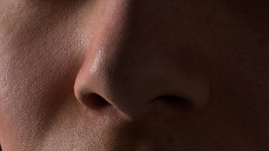 Siyah arka planda genç bir kadının Macro profili. İnsan burnuna yakın çekim. İnsan derisi. Yüzüne bir gölge düşer. 3d illüstrasyon