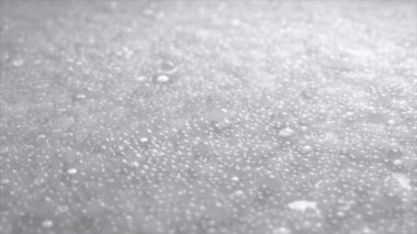 Kabarcıkların arka planı. Bir mat yüzeyinde parlak su damlacıkları, aşırı gerçekçi detaylar. 3 Boyutlu Canlandırma.