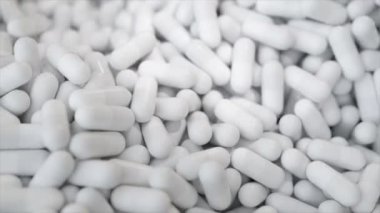 Sonsuz üç boyutlu animasyonda beyaz kapsüller.