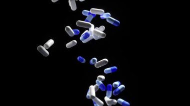 Uyumlu bir zemin üzerine akan mavi tıbbi kapsüller akışı, ilaç endüstrisiyle bağlantılı bir aşırı doz konseptini gösteriyor..