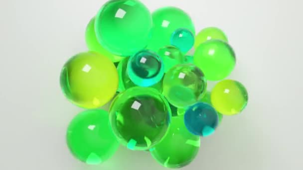 緑と青の色合いの光沢のある半透明球は この3Dレンダリングでクールで爽快な雰囲気を醸し出します — ストック動画