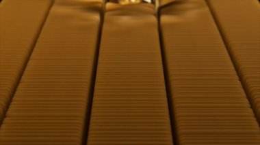 Animasyon, beyaz bir arkaplana karşı altın çubukları bükme yolunda süzülen altın bir küreyi, dinamik ve zarif bir görsel efekt yaratır.