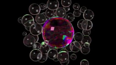 Şeffaf kabarcıklar siyah arkaplandaki daha büyük yanardöner bir küreye doğru hareket ediyorlar. Parlak, sıcak renkli bir ışık kümesi oluncaya kadar onunla birleşirler.