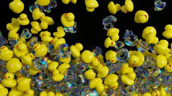 Sarı plastik ördekler ve yanardöner sabun baloncukları düşüyor, yavaşça karanlık yüzeyde birikiyor, oyuncu hareketler ve dinamik etkileşimle soyut ve tuhaf bir görsel kompozisyon oluşturuyor.