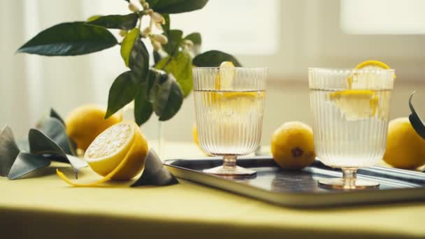 Glasses Water Lemon Refreshing Healthy Drinks Table Decorated Lemons Flowers — Stock Video