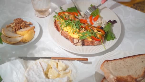 Closeup Eating Toast Scrambled Egg Pickled Vegetables Table White Tablecloth — Stock Video