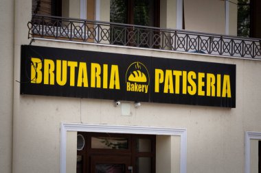 TIMISOARA, ROMANIA - SEPTEMBER 16, 2022: Signage of a Romanian bakery and pastry shop in Timisoara, which is said Brutaria Patiseria in Romanian