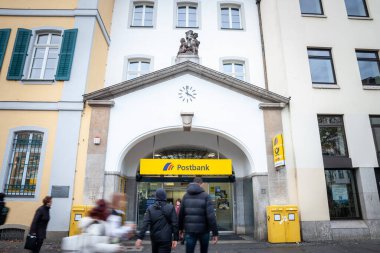 BONN, GERMANY - NOVEMBER 7, 2022: Logo of Deutsche Postbank on their local office in Bonn. it's the retail division of Deutsche Bank