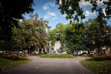SZEGED, HUNGARY - SEPTEMBER 18, 2022: Vasarhelyi Pal statue in Szechenyi ter square park in Szeged. Designed by Lajos Matrai in 1905, it's dedicated to Vasarhelyi Pal, a hungarian hydraulic engineer. 
