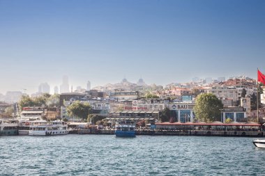 ISTANBUL, TURKEY - MAY 21, 2022: ferry boats in the harbour of besiktas ortakoy, called besiktas iskelesi, called vapur, a ferry connecting European and Asian sides of Istanbul and Bosphorus strait.