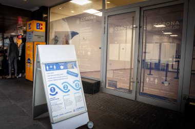 DORTMUND, GERMANY - NOVEMBER 5, 2022: Sign indicating a coronavirus covid testing center in Dortmund, PCR test and Rapid Antigen test (Schnelltest) during  Covid 19  pandemic