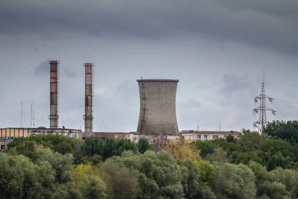 Selective blur on Arad power station, also called CET arad, seen from afar with its typical chimneys. It is a coal power plant, one of the main electricity producers in Romania..