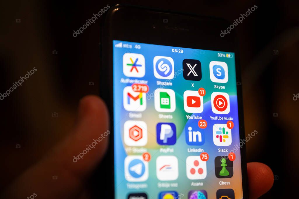 BELGRADE, SERBIA - AUGUST 18, 2023: Selective blur on the Twitter X app new logo on an Apple Smartphone. X is the new name of Twitter Since Elon Musk took over.