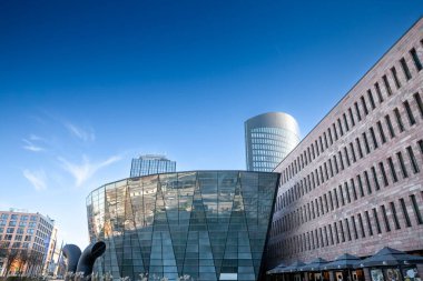 DORTMUND, GERMANY - 15 Kasım 2022: Dortmund Skyline with the RWE tower and the Dortmund Stadt und Landesbibliothek, or the City and state library of Dortmund, the main culture landmark of the city.