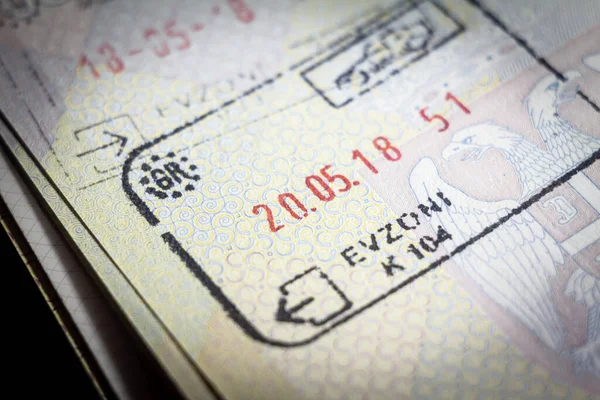Selective blur on a Greek passport stamp on a serbian passport, from Evzoni border crossing between Greece and Macedonia, abiding by European union Schengen passport stamps regulations.