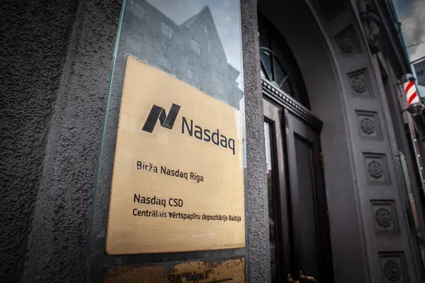 stock image RIGA, LATVIA - AUGUST 21, 2023: Logo of Nasdaq on their local office for Latvia in Europe in Riga. Nasdaq or national association of securities dealers automated quotations is american stock exchage.