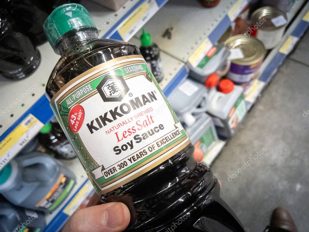 BELGRADE, SERBIA - JANUARY 20, 2024: Logo of Kikkoman on their soy sauce bottle for sale. Kikkoman is a japanese food corporation known for soy products and food seasoning.