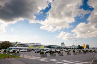 RIGA, LATVIA - AUGUST 25, 2023: Main building of the departures terminal of RIX, or Riga Airport, the main airport of Latvia. clipart