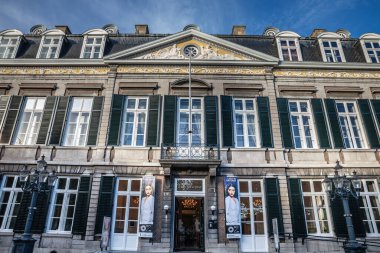 MAASTRICHT, NETHERLANDS - NOVEMBER 10, 2022: main facade of the theater ann het vrijthof in Maastricht. vrijthof theater is a major landmark, a theatre, concert hall and cultural venue in netherlands. clipart