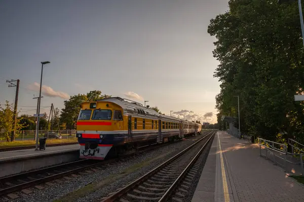 stock image Selective blur on a regional train, a diesel DMU of latvian railways ready for departure in Sigulda to Riga at dusk. It's one of the main public transportation axis of Latvia.