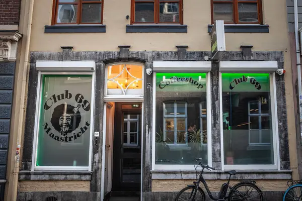 stock image MAASTRICHT, NETHERLANDS - NOVEMBER 10, 2022: entrance to Club 69, a dutch coffeeshop of Maastricht. In netherlands, a coffeshop is a place where people can buy & smoke marijuana & weed, that are legal.