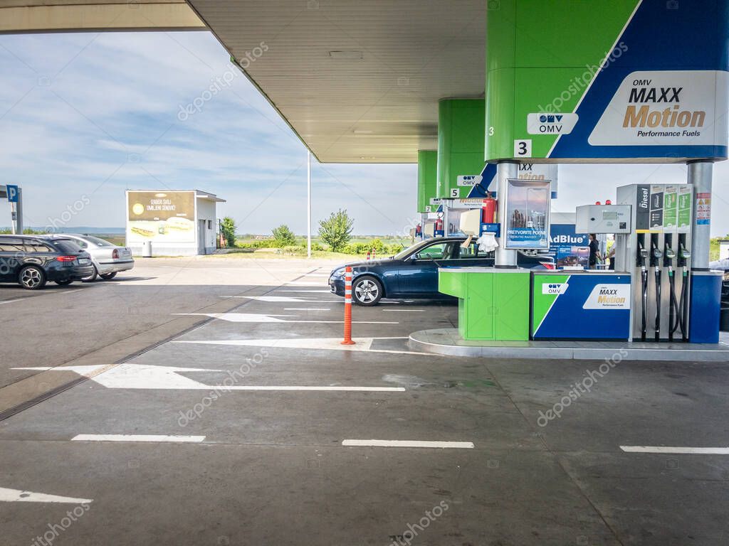 BELGRADE, SERBIA - APRIL 14, 2024: Logo of OMV on one of its gas stations of Belgrade. OMV is an Austrian petroleum and gas company spread all accross Europe.