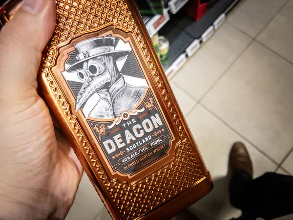 Stock image BELGRADE, SERBIA - MAY 21, 2024: Logo The Deacon Scotch Whisky on a Bottle with Ornate Design for sale in a Belgrade Store. The Deacon is a brand of scotch whisky alcohol.