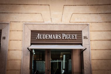 ROME, ITALY - JUNE 15, 2024: Audemars Piguet logo on their jewelry boutique in Rome. Audemars Piguet is a Swiss luxury watchmaker famous for chronographs and watches. clipart