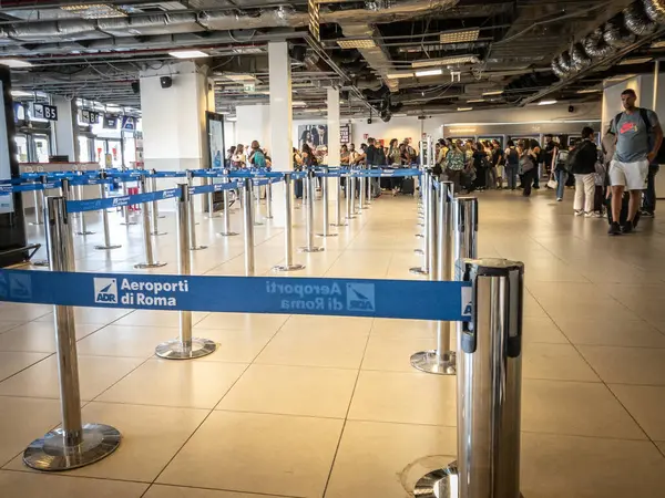 Stock image ROME, ITALY - JUNE 15, 2024: Logo of Aeroporti di roma in front of Boarding Gates at Rome Ciampino Airport. Aeroporti di Roma is the company in charge of managing Fiumicino and ciampino rome airports.