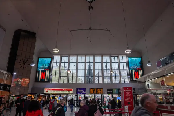 stock image DUSSELDORF, GERMANY - NOVEMBER 7, 2022: Passengers walking by the main hall of Dusseldorf Hbf, or Dusseldorf Hauptbahnhof, the main railway hub of the german city with its departures board.