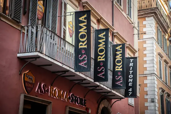 stock image ROME, ITALY - JUNE 15, 2024: AS Roma logo on their official store in Rome displays the club's merchandise. AS Roma is one of rome's football clubs and teams.