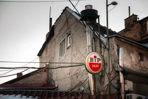 stock image BELGRADE, SERBIA - JUNE 12, 2022: Selective blur on a BIP Logo on a retailer bar in Belgrade. BIP, or Beogradska Industrija Piva, was a Serbian brewery and producer of beer.