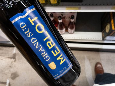 BELGRADE, SERBIA - AUGUST 21, 2024: Grand Sud logo on a Merlot wine bottles on sale in a Belgrade supermarket. Grand Sud is a French wine producer from languedoc. clipart