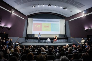 BELGRADE, SERBIA - OCTOBER 26, 2023: Selective blur on Thomas Piketty smiling posing before a lecture in belgrade, Serbia. Thomas Piketty is a French economist specialized in the studies of inequality. clipart