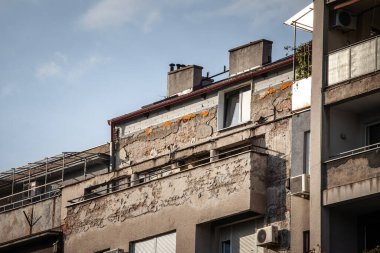 Selective blur on a building in belgrade, with an illegal building addition, with the construction of several additional floors and stories above the roof made without the approval of the urbanism law clipart