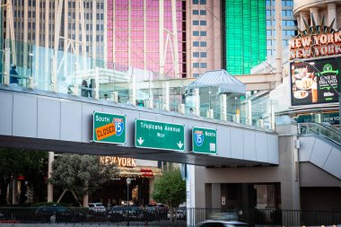 LAS VEGAS, AUGUST 21, 2024: Road signs in Las Vegas indicating closed Interstate 15 and directions to Tropicana Avenue, reflecting urban planning and ongoing construction work in the city. clipart