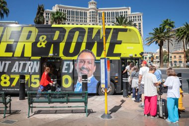 LAS VEGAS, AUGUST 21, 2024: People queue to board the Deuce bus along the Las Vegas Strip. Operated by RTC, the deuce on the strip is an urban transit bus service operating on Las vegas boulevard. clipart