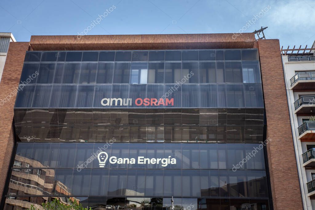 VALENCIA, SPAIN - OCTOBER 13, 2024: The AMS Osram logo is visible on the facade of an office building in Valencia. AMS Osram is a global provider of sensor and lighting technology solutions.