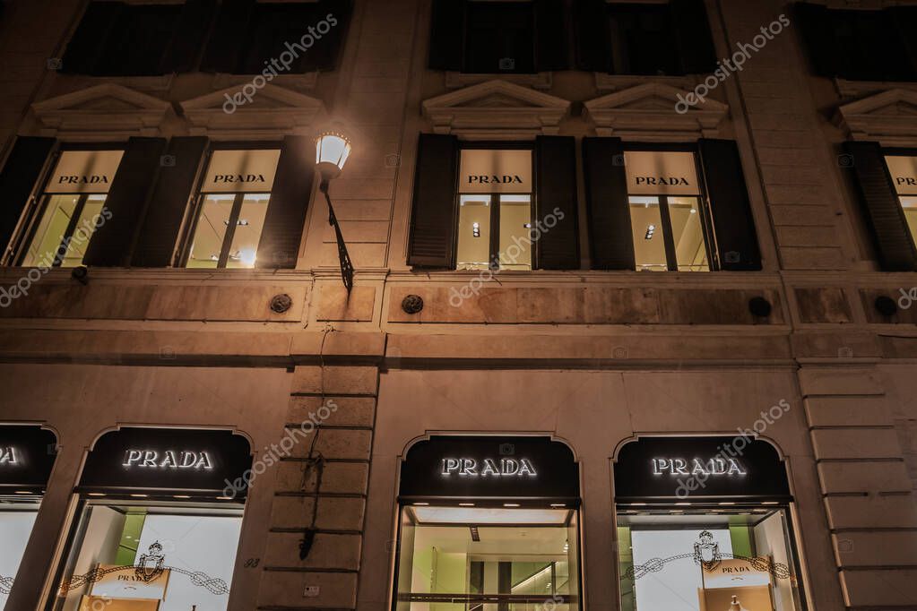 ROME, ITALY - JANUARY 15, 2025: Illuminated Prada boutique in Rome, Italy. Prada is a luxury fashion designer, manufacturer and retailer from Italy.