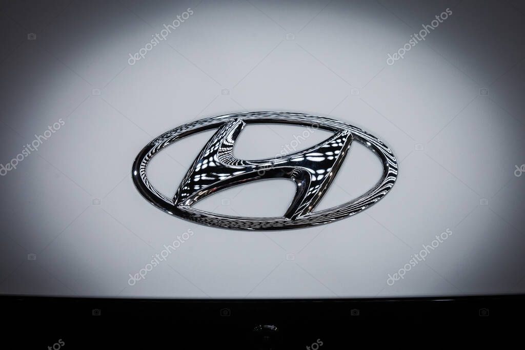 BELGRADE, SERBIA - MARCH 21, 2025: Chrome Hyundai logo H badge gleams against a white bonnet in Belgrade. Hyundai motor company is an automobile manufacturer an korean automotive corporation.