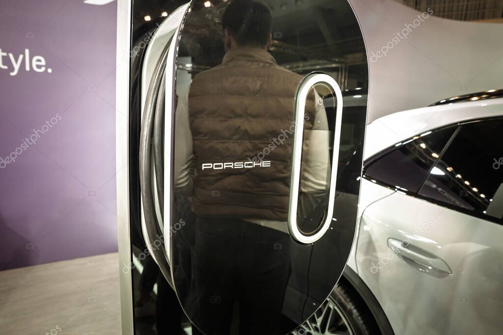 BELGRADE, SERBIA - MARCH 21, 2025: Logo of Porsche on rapid EV wallbox, electric car charger for Porsche electric vehicles. Porsche is a German car manufacturer, specialized in luxury sports vehicles.