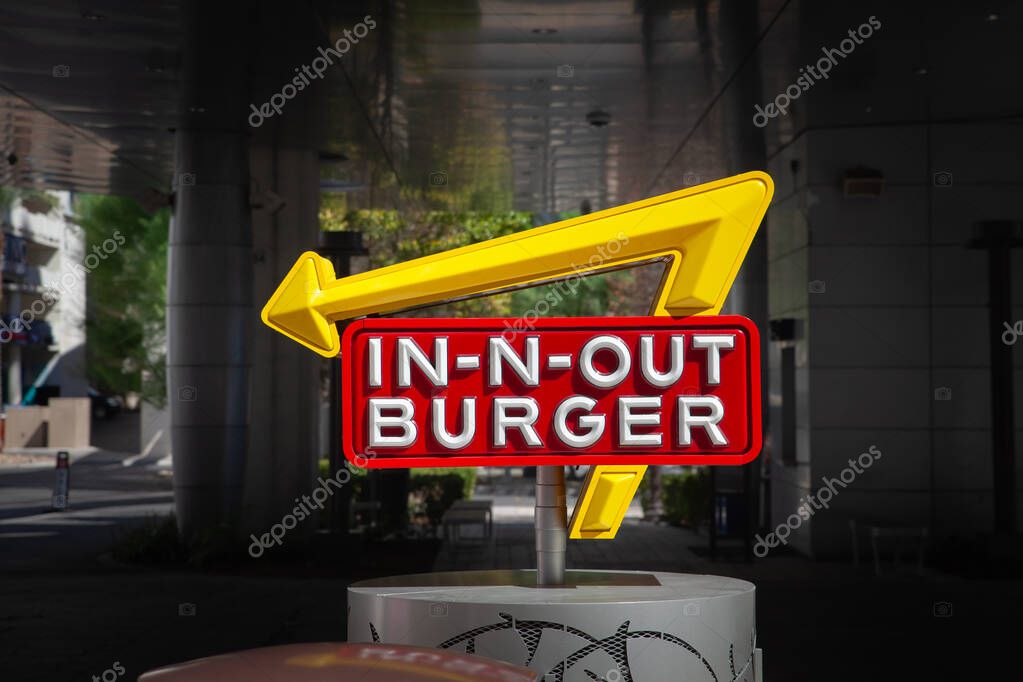 LAS VEGAS, AUGUST 21, 2024: Classic logo of In N Out Burger with arrow sign, yellow and red with bold lettering, stands off the Las Vegas Strip, InNOut Burgers is an american fast food chain.